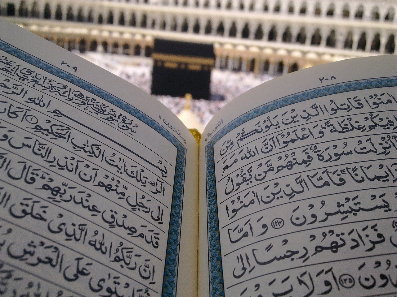 Quran book in front of Kaaba