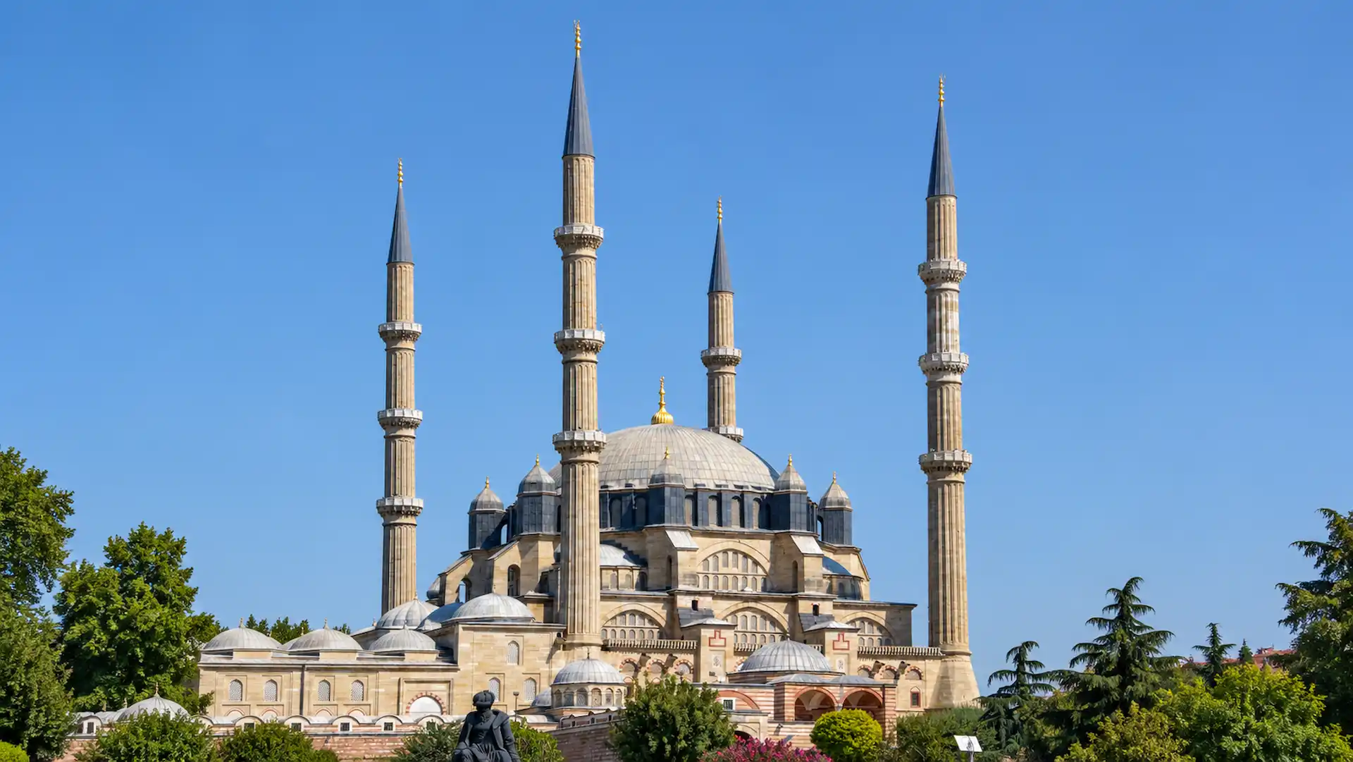 Selimiye Mosque in Edirne, Turkey, featuring four towering minarets, a grand Ottoman dome, and historic Islamic architecture under a clear blue sky.