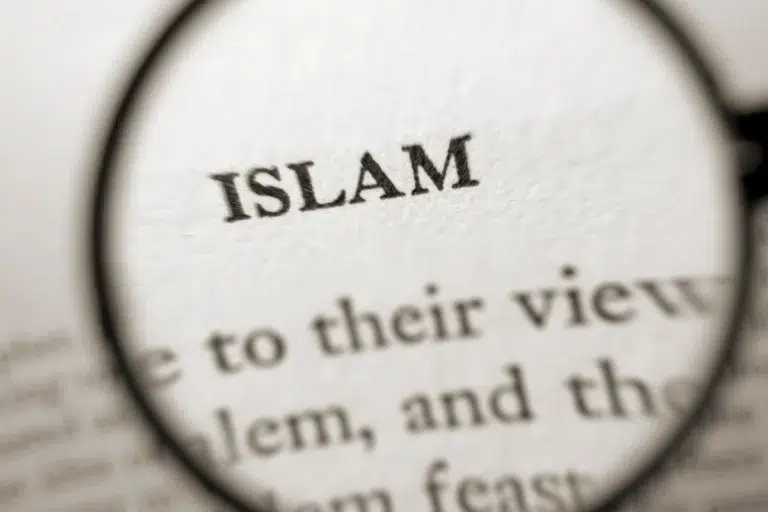 Magnified text highlighting the word 'Islam' in focus, symbolizing the pursuit to learn and understand the teachings of Islam.