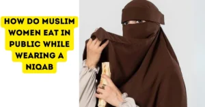 Muslim woman eating in public while wearing a niqab, lifting the face covering modestly to eat a wrap, demonstrating techniques for niqab and eating.
