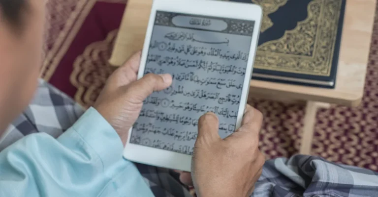 nline Quran Classes for Kids – A child reading the Quran on a tablet with a physical Mushaf nearby, symbolizing digital Islamic learning for children.
